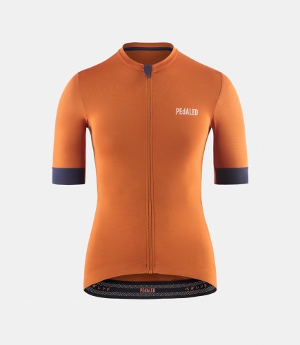 women-cycling-jersey-orange-essential-front-pedaled.jpeg