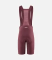 women-cycling-bibshort-burgundy-element-back-pedaled.webp