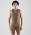 men-cycling-cargo-bibshort-brown-odyssey-total-body-front-pedaled.webp