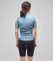 women-cycling-insulated-vest-light-blue-odyssey-total-body-back-pedaled.webp