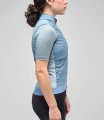 women-cycling-insulated-vest-light-blue-odyssey-side-pedaled.webp